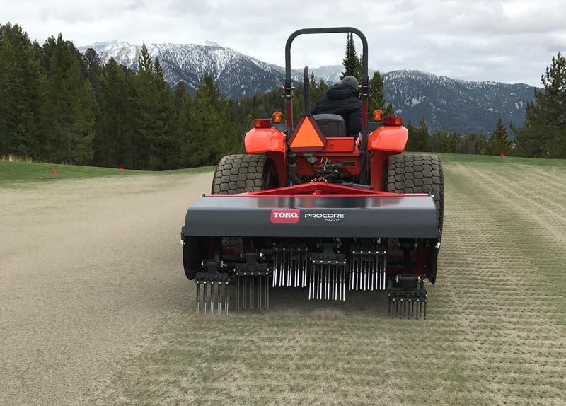 Golf course greens aerification using the numbers Deep-tine aeration
