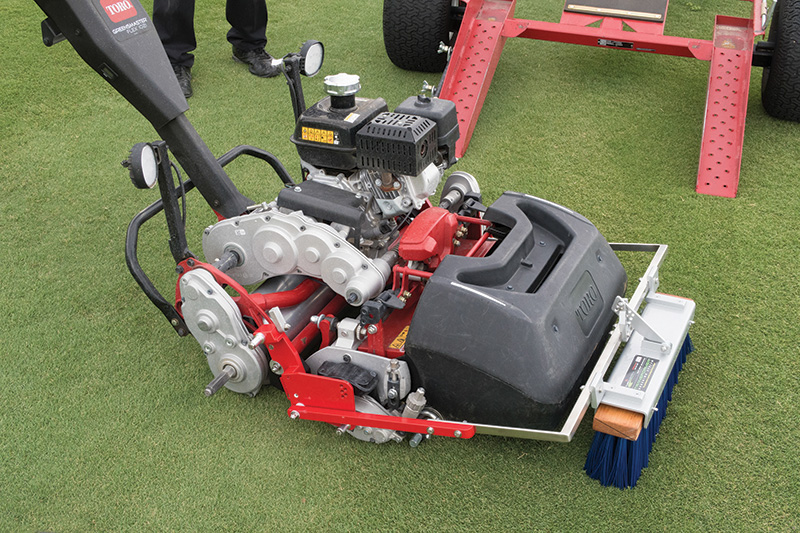 greensmower fitted with front brush