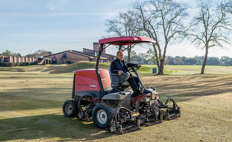 Arturo Hernandez mowing