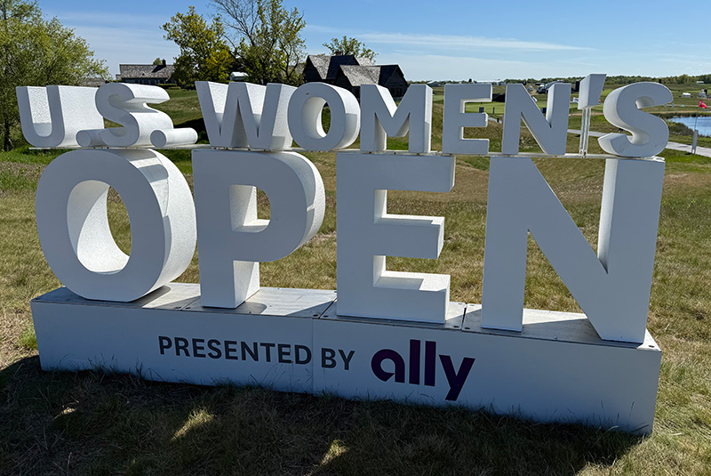 U.S. Women's Open sign standing on a golf course