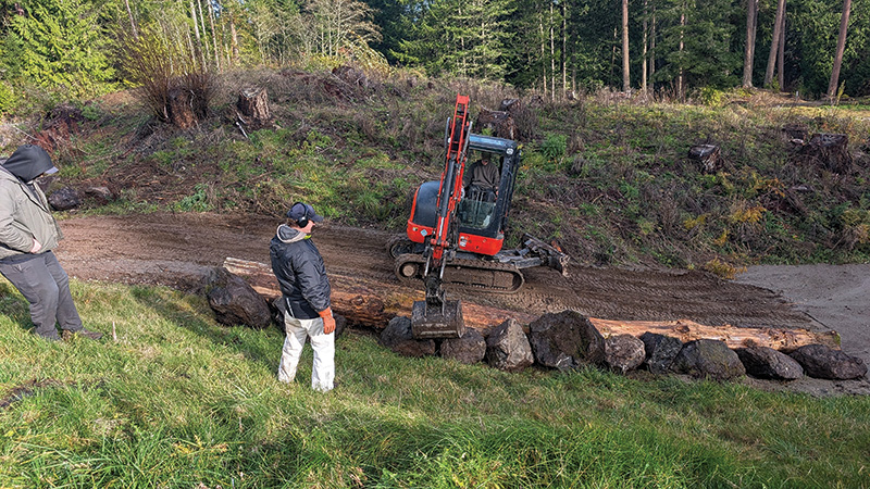 Crew members working outdoors on a golf course